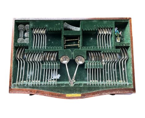 A canteen of Elkington silver plate cutlery for six settings in a walnut table with cabriole legs. 