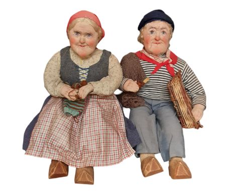A pair of character dolls 1930's/ 40's made from stockinette with painted features, dressed as traditional French peasants wi