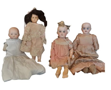 Four early 20th century small bisque head dolls including a Welsch &amp; Company doll mould 300 with jointed composition body