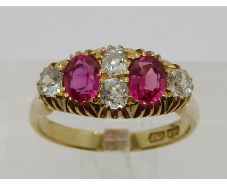 Antique 18ct ruby and diamond ring, the diamonds 0.15ct each approx, maker 'HPH', size P, 5.1g