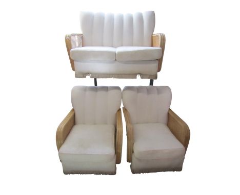 A three piece Bergere caned conservatory suite comprising two seat settee sofa and matching pair of club elbow chairs in the 