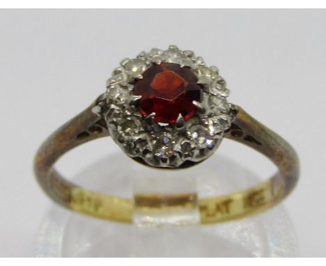 18ct platinum set garnet and diamond cluster ring, size L, 2.7g