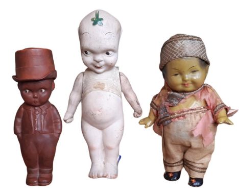 Three early 20th century kewpie type dolls comprising a Fumsup bisque figure with jointed arms height 20cm, a brown rubber do