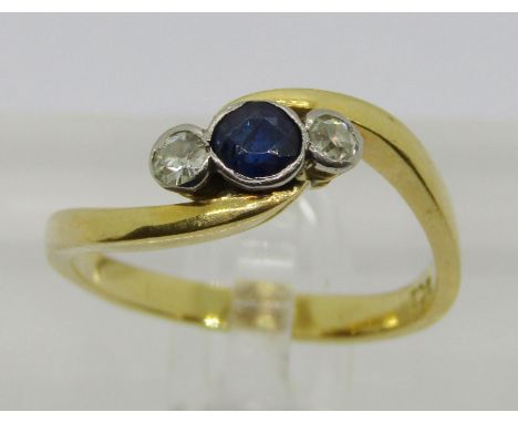18ct bezel set sapphire and diamond three stone crossover ring, diamonds 0.10ct each approx, size Q, 3.8g