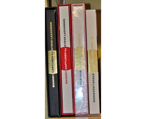A small library of four books referencing Banksy, three of which are limited editions (28/1000) in their original slip cases,