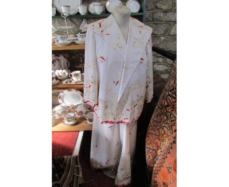 A mid 1950s Debutante's dress and jacket, ivory silk with red and gold chinoiserie decoration, three-quarter length sleeves