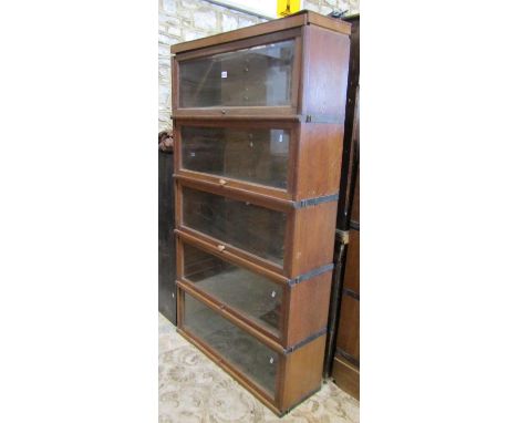 A Globe Wernicke five sectional stacking oak library bookcase with up and over rectangular glazed panelled doors, 160 cm h x 