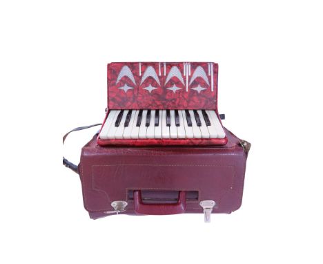 A red pearlised Gallotta piano accordion, in working order with carry case.