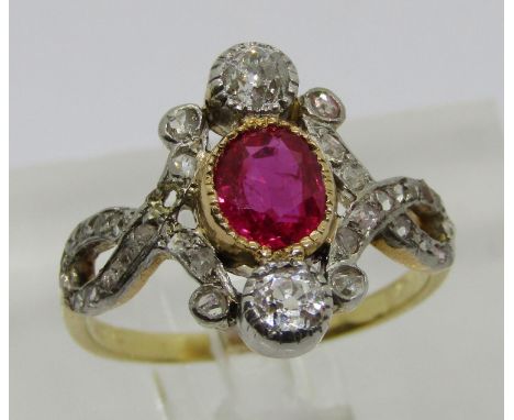 19th century 18ct bezel set ruby and diamond ring, the oval ruby flanked by a pair of diamonds 0.15ct each approx, with furth