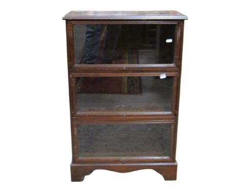 A miniature Globe Wernicke typed mahogany three sectional enclosed bookcase, 87cm high x 55cm x 31cm, together with a miniatu