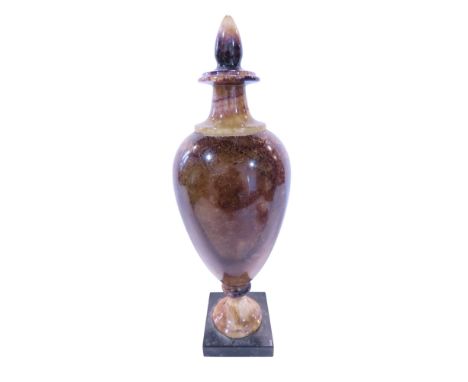 A Blue John stone urn, on a square plinth, 32cm (broken and glued at base)