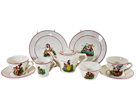 A vintage child's tea service showing Snow White and Dwarves set in a Mickey Mouse box 