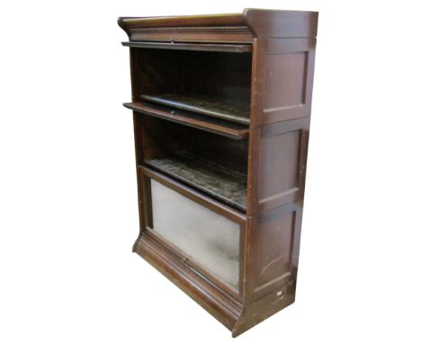 A walnut Globe Wernicke style three sectional floor standing library bookcase with up and over rectangular glazed panelled do