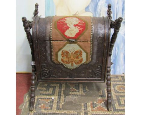 A 19th century domed top hinged casket with carved detail and tapestry panel, raised on turned bobbin x framed supports with 
