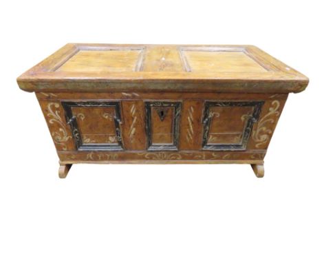 A 19th century German coffer in pine, the three panelled front with original painted detail, 57cm high x 122cm x 65cm