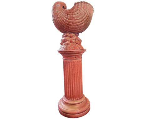 A Victorian Burmantofts faience fluted column supporting an outsized nautilus shell on a seaweed base stamped 623 and 815, ov