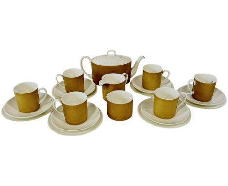 A Susie Cooper Amber coloured tea service for six with teapot, milk jug and sugar basin