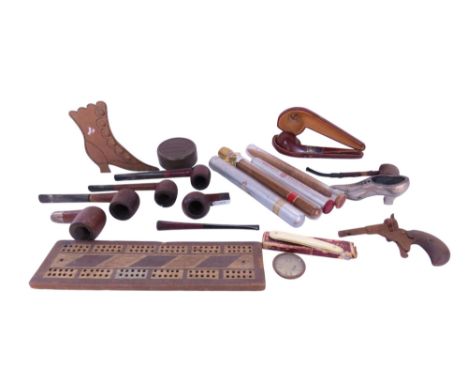 A handmade Bering cigar sealed in a glass tube, together with three further cigars, a selection of old pipes, and other bygon