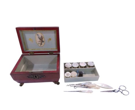 A Regency leather sewing casket shaped box with a sectioned interior holding mother-of-pearl spindles, small scissors and oth
