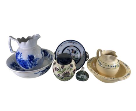 A Cobridge stoneware oviform ginger jar and cover with floral detail, studio ware ewer and basin with floral detail, further 