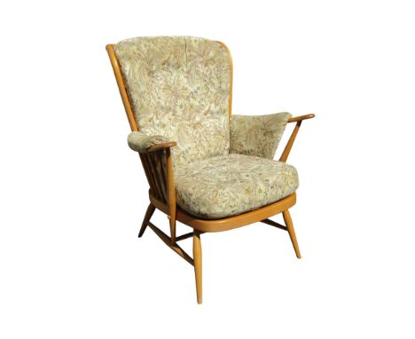 An Ercol Windsor style armchair with light beechwood frame and loose upholstered cushions 