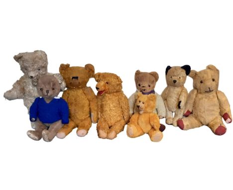 Eight vintage teddy bears all with jointed body and stitched noses,  including a Sooty bear height 31cm. Most are in need of 