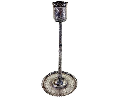 A Middle Eastern richly engraved candlestick with later conversion to a table lamp, drilled to base. 42cm high