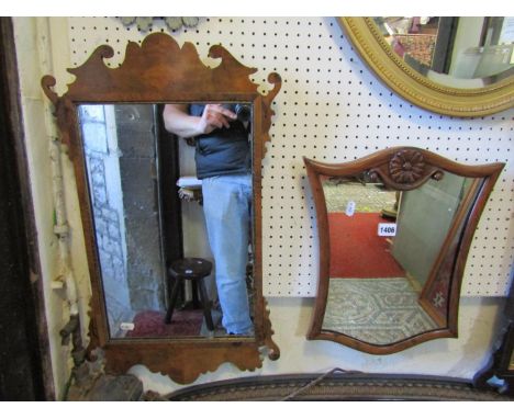 A small Chippendale style walnut wall mirror with fret carved surround, 66 cm x 40 cm together with one other with shield sha