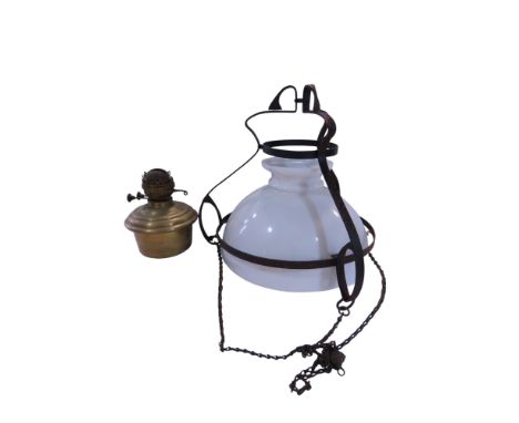 A hanging oil lamp with an opaque glass shade 