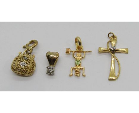 Group of small yellow metal pendants / charms to include a 9ct diamond set example in the form of a handbag, an illusion set 
