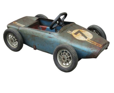 A vintage child's pedal car in the form of a racing car with number 7 to bonnet (af) 
