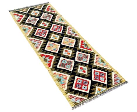 A Maimana Kilim runner with rows of diamonds on a dark ground 190cm x 64cm approximately 