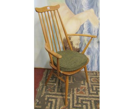 An Ercol light beechwood framed stick back open elbow chair with ‘cow horn’ rail 