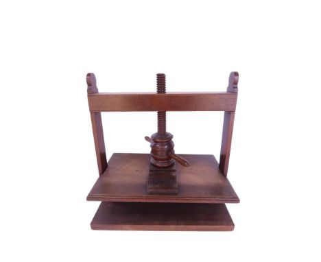 A Georgian mahogany book press in working order, 38cm high x 36cm wide.