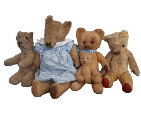 Five small vintage teddy bears with stitched nose and glass eyes, playworn, with largest bear 45cm missing an eye (5)