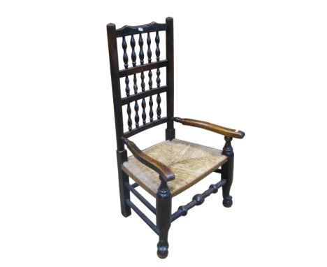 A low rush seated Lancashire spindle back open armchair together with a small reproduction drum table and a mahogany lazy Sus