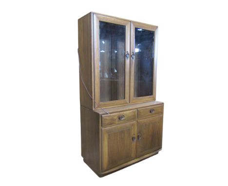 A small Ercol glazed cabinet on chest, 161cm high x 91cm x 47cm (max)