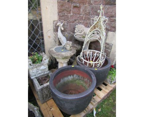 A mixed collection of decorative garden effects to include a weathered composition stone sundial, bird bath, painted metal wo