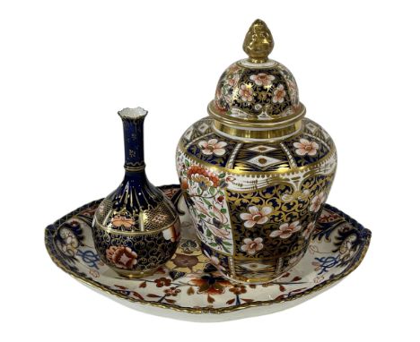 A Derby Imari pattern vase and cover, a further Derby Imari onion vase and a Derby Imari dish (3)