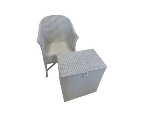 A Lloyd Loom chair and laundry basket in matching cream painted colourway 