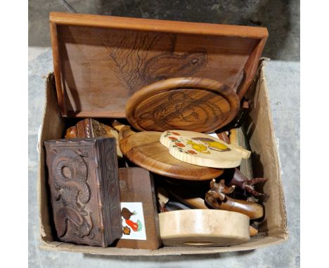 Assorted treen, 20th century wooden boxes, a pierced folding bookend, a teak two-handled tray, various carved wooden animals 