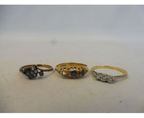 An 18ct gold ring set with sapphires (one stone missing), approx. 2.6g plus two 18ct gold and silver rings combined weight ap