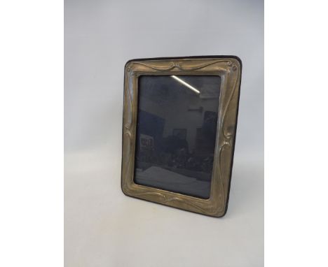 A silver photograph frame in the Art Nouveau style, maker K F Limited, London 1991.