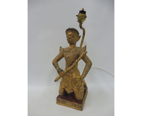 A gilt figural table lamp. 