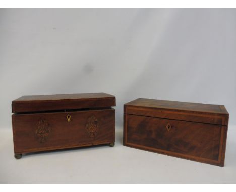 A George III mahogany and inlaid tea caddy with fitted interior, 12" wide and another banded mahogany tea caddy, 12" wide. 