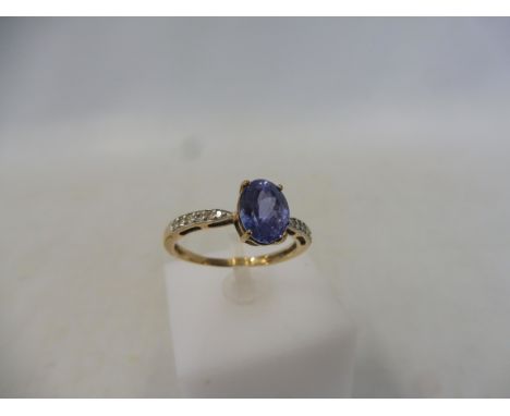 A tanzanite and diamond gold ring, size R to S, approx. weight 2.2g.