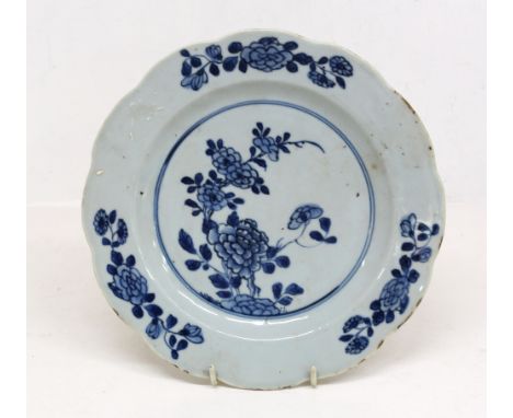 A Chinese blue and white export porcelain plate, Qianlong Emperor, circa 1750, of lobed circular shape painted with peony spr