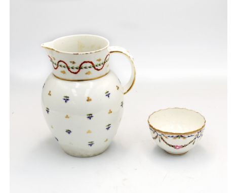 A Pinxton straight fluted tea bowl, decorated with flower swags below a gilt trellice and blue ribbon border, approx. 5.4cm h