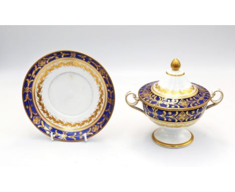 An early 19th century English porcelain covered sucrier and stand, decorated with cobalt blue and gilt decoration, unmarked, 