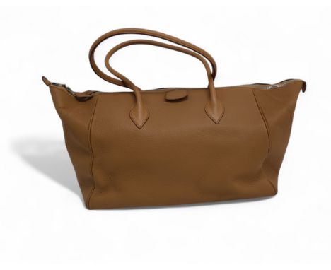A Hermes Paris Bombay leather handbag in camel with leather interior, five stud feet, three interior pockets and double zip. 